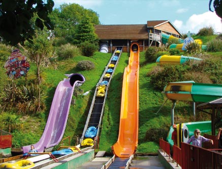 Water slides and rides at Woodlands theme park on a sunny day